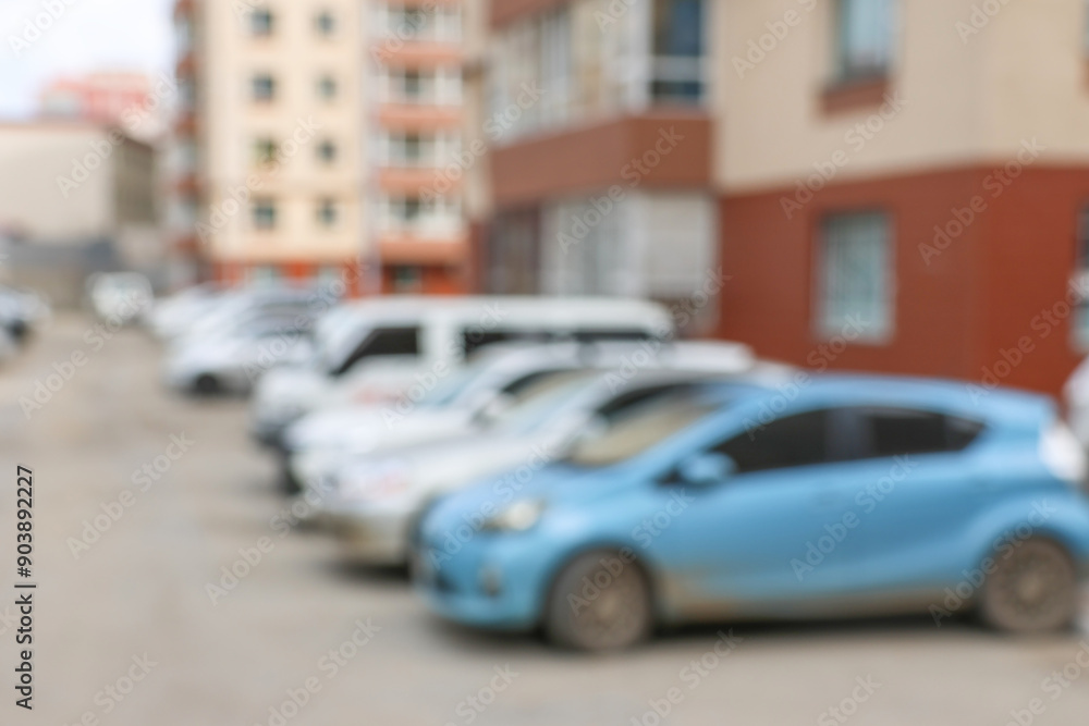 Fototapeta premium Blur outdoor car park in the official place and the hot sun. Cars parked in a row. blur and abstract background