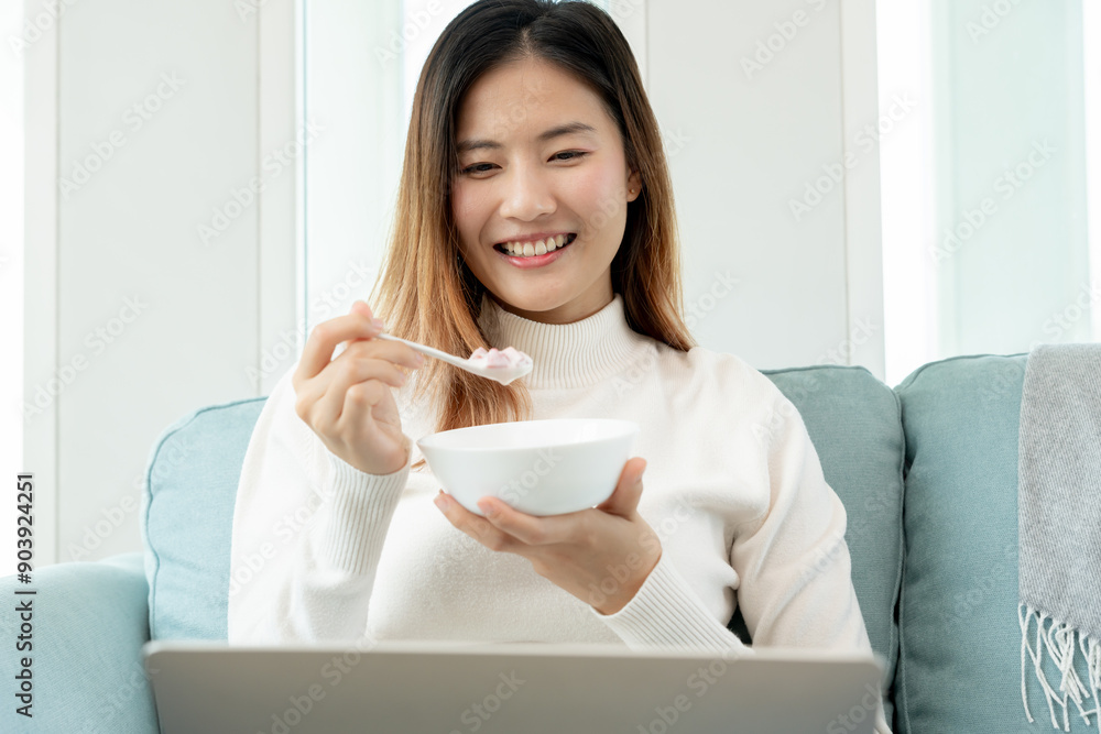 healthy food. Beautiful female girl enjoy eat yogurt, use laptop relax, fresh fruits on breakfast health in house. Happy young woman smile on morning good emotion. dieting, detox, diet, clean. healthy food. Beautiful female girl enjoy eat yogurt, use laptop relax, fresh fruits on breakfast health in house. Happy young woman smile on morning good emotion. dieting, detox, diet, clean.