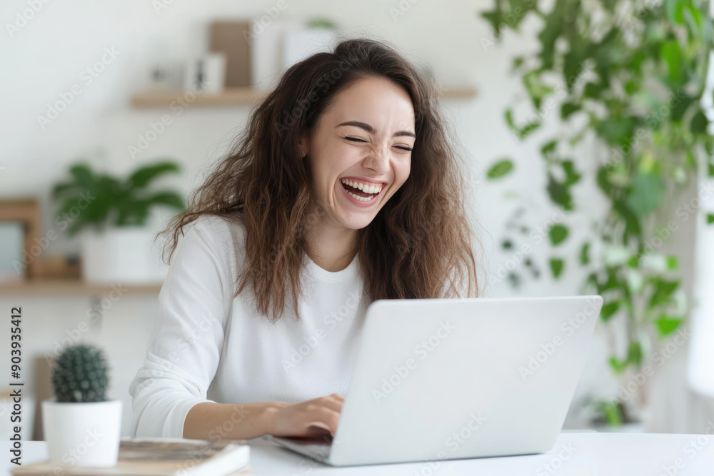 Canadian business woman happy working using laptop at office work place Canadian business woman happy working using laptop at office work place