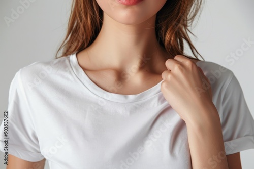 Woman wearing plain white t-shirt for mockup. Fashion model female with white t-shirt and neutral background