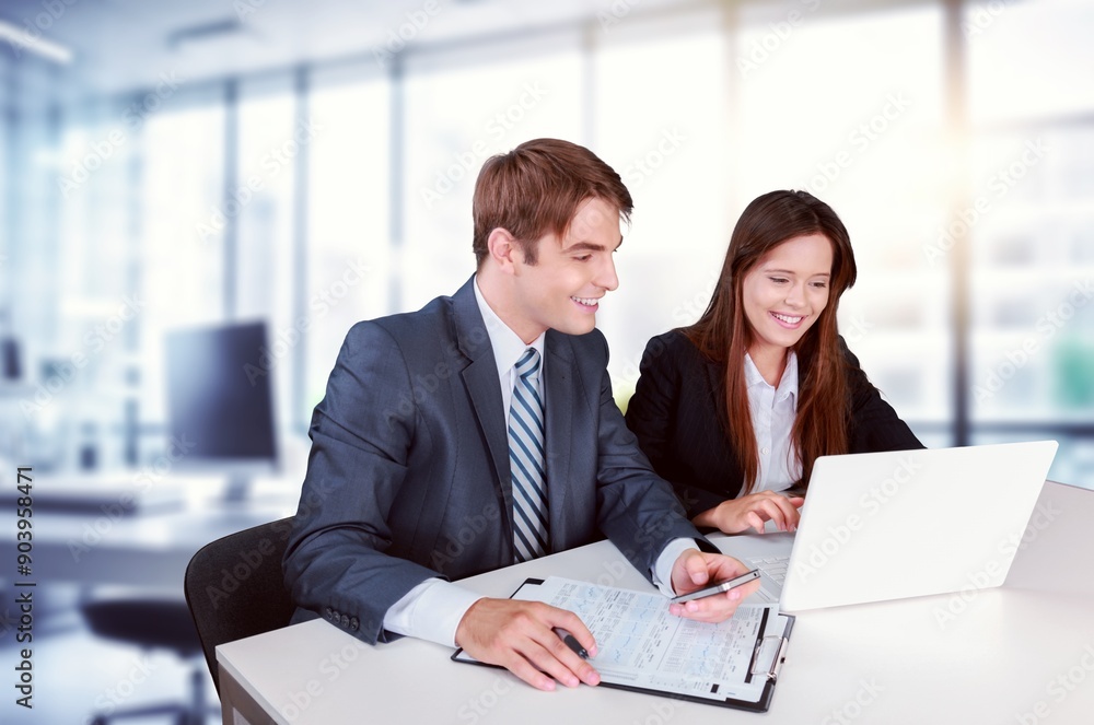 Smiling financial advisor consulting client at meeting Smiling financial advisor consulting client at meeting