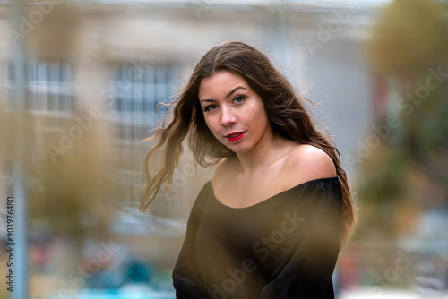 Young Woman With Long Hair Poses Outdoors in City During Autumn Afternoon Free Download Young Woman With Long Hair Poses Outdoors in City During Autumn Afternoon - GFXLoad