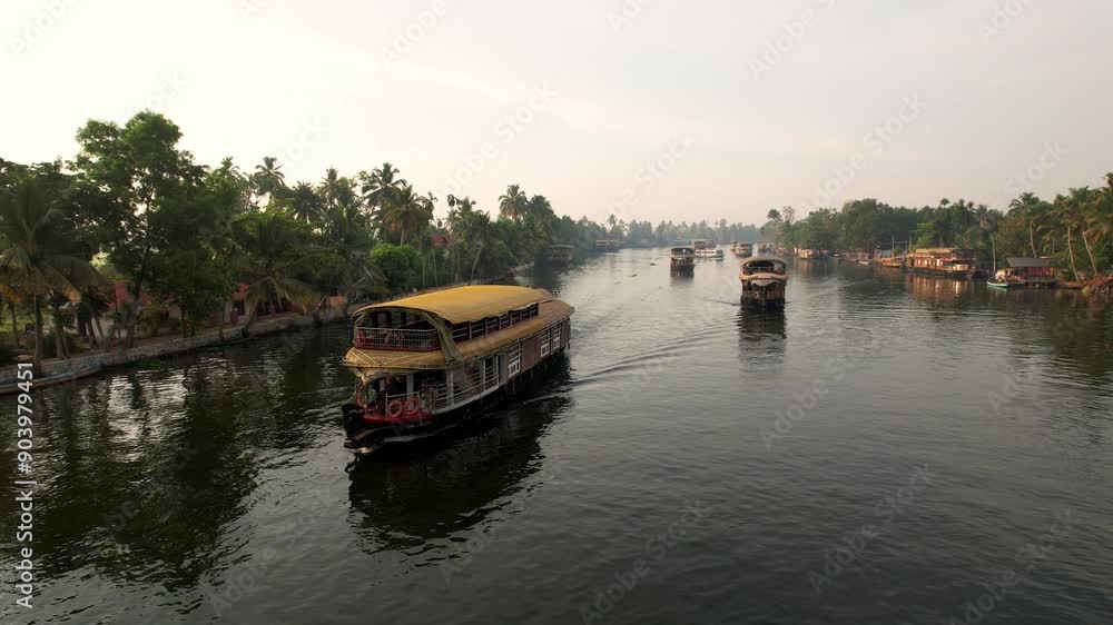 Houseboats in Kerala, Aerial view, Alleppey India. Travel along the canals with palm trees growing along the shores of Kerala. Concept of vacation Houseboats in Kerala, Aerial view, Alleppey India. Travel along the canals with palm trees growing along the shores of Kerala. Concept of vacation