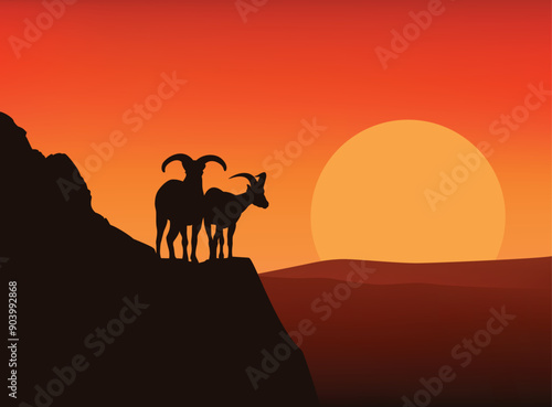 pair of mountaing goats standing on high cliff at sunset - horizontal vector silhouette view of copy space dramatic wilderness scene with dagestan turs