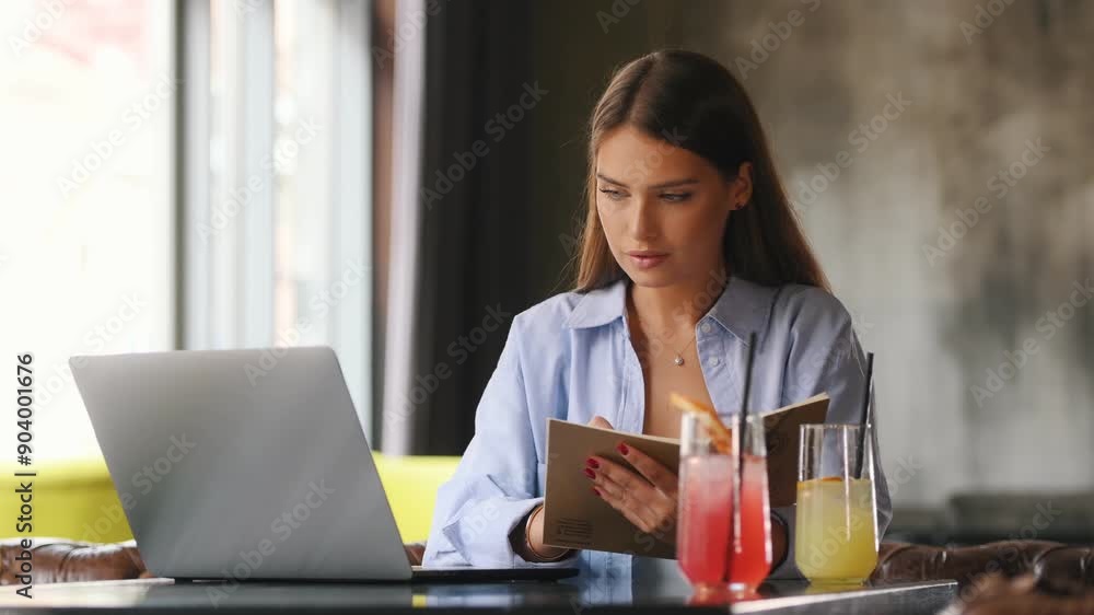 Caucasian freelancer making online webinar translation during remote working in street cafe, skilled female graphic designer with laptop computer communicate during video calling on netbook Caucasian freelancer making online webinar translation during remote working in street cafe, skilled female graphic designer with laptop computer communicate during video calling on netbook