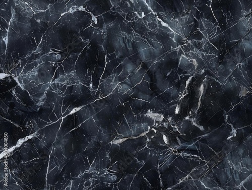 Abstract black marble texture with white veins.