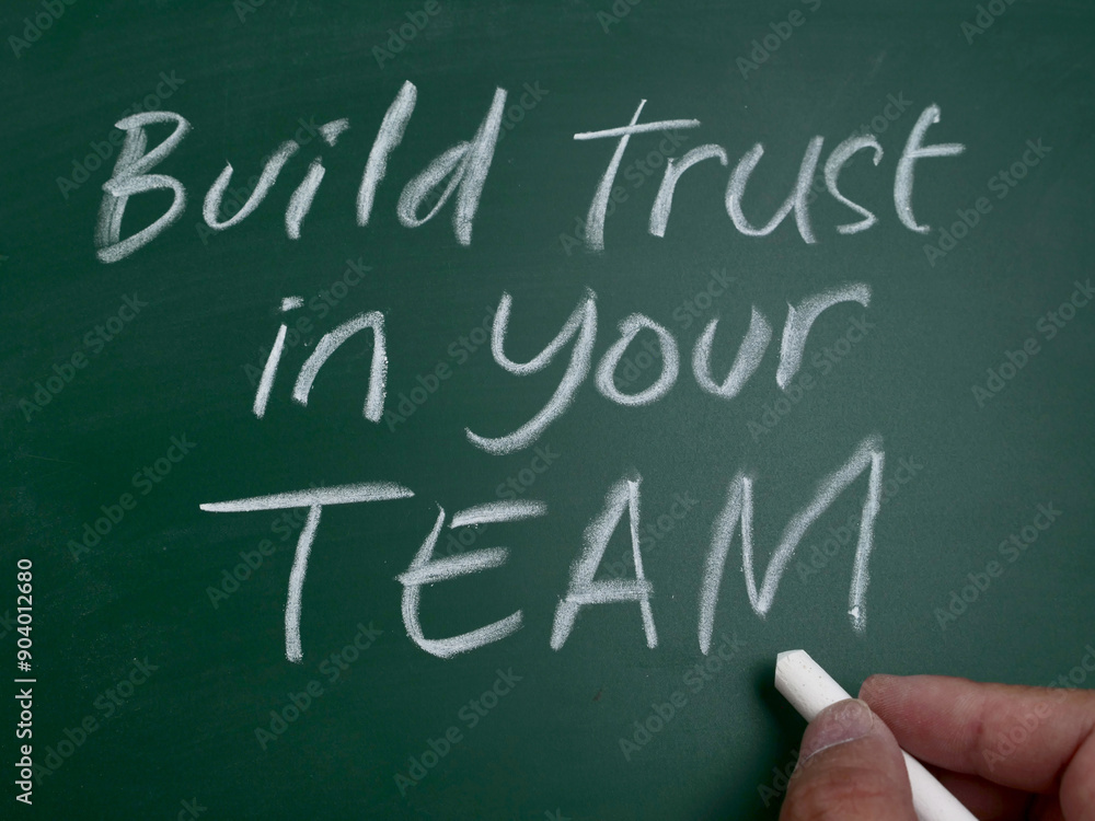 Build trust in your team, word text written on chalkboard, motivational inspirational quote Build trust in your team, word text written on chalkboard, motivational inspirational quote