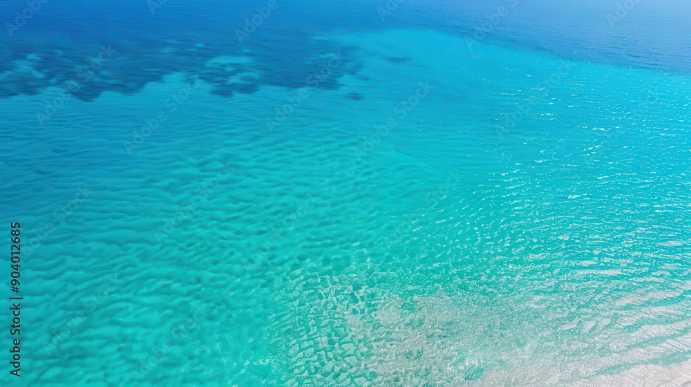 Aerial view of crystal clear ocean water with gentle waves and sandy bottom, creating a serene and tranquil seascape.
Aerial view of crystal clear ocean water with gentle waves and sandy bottom, creating a serene and tranquil seascape.