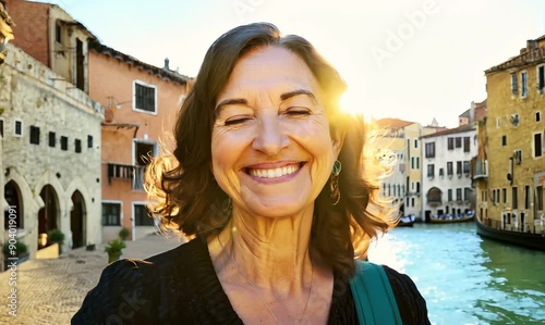 Portrait of smiling middle-aged woman in the street of Venice, Italy