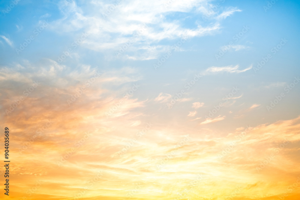 Obraz premium Beautiful , luxury soft gradient orange gold clouds and sunlight on the blue sky perfect for the background, take in everning,Twilight, Large size, high definition landscape photo