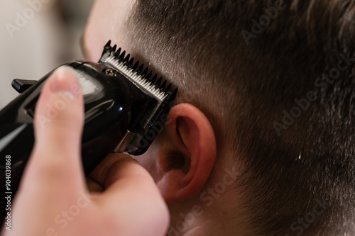 Konstfotografi Haircut and alignment of the head contour with a hair clipper trimmer