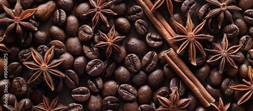 Christmas themed coffee beans background with anise stars and cinnamon sticks perfect for holiday copy space image