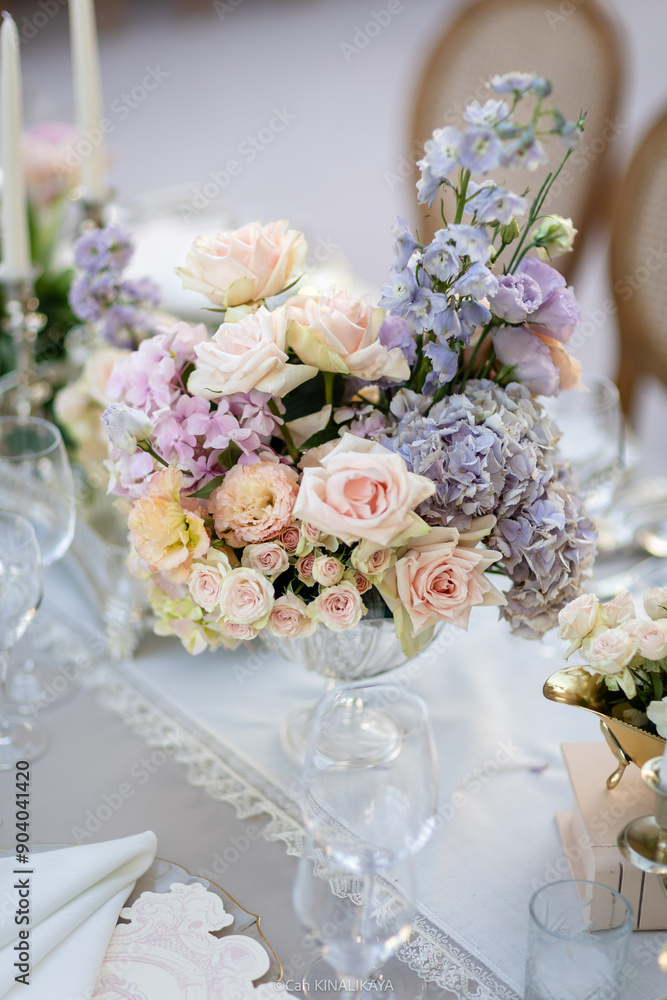 Elegant Wedding Reception Decor with Pastel Floral Arrangements and Crystal Chandeliers Elegant Wedding Reception Decor with Pastel Floral Arrangements and Crystal Chandeliers