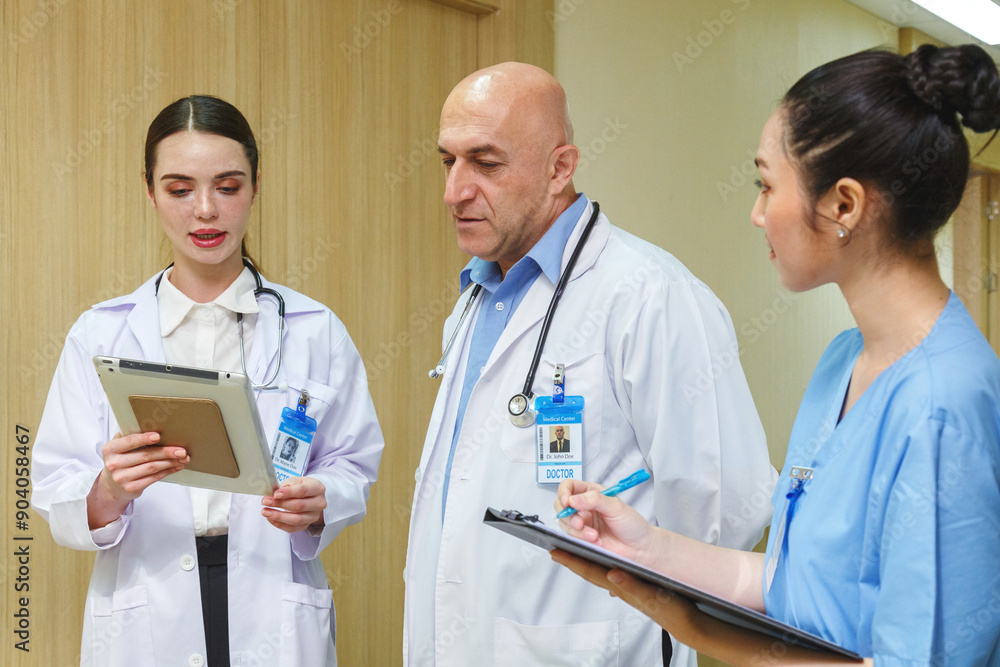 team doctor, nurse and internship talking and meeting about surgery treatment patient’s case in hallway office in hospital. healthcare and medical education concept. team doctor, nurse and internship talking and meeting about surgery treatment patient’s case in hallway office in hospital. healthcare and medical education concept.