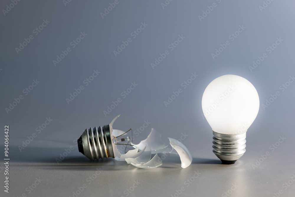 © patpitchaya - Comparative a broken and a glowing light bulb, old and new idea, failure and success, self development, and learning from mistakes