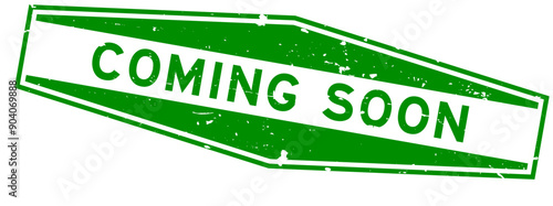 Grunge green coming soon word hexagon rubber seal stamp on white background