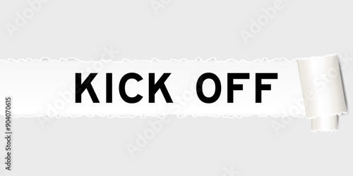 Ripped gray paper background that have word kick off under torn part