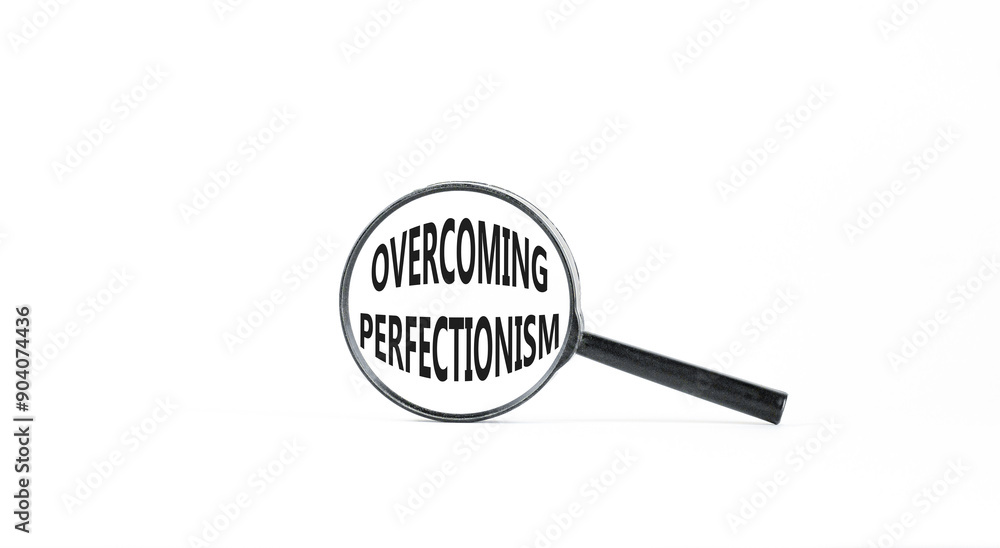 Overcoming perfectionism symbol. Concept words Overcoming perfectionism in beautiful magnifying glass. Beautiful white paper background. Business Overcoming perfectionism concept. Copy space. Overcoming perfectionism symbol. Concept words Overcoming perfectionism in beautiful magnifying glass. Beautiful white paper background. Business Overcoming perfectionism concept. Copy space.