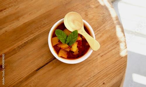 Potato soup in bowl over wooden background. Top view, flat lay