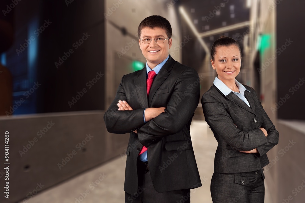 Portrait of two business people standing together Portrait of two business people standing together