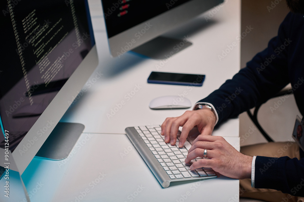 Minimal high angle closeup of unrecognizable man typing on keyboard and using computer while working at desk copy space Minimal high angle closeup of unrecognizable man typing on keyboard and using computer while working at desk copy space