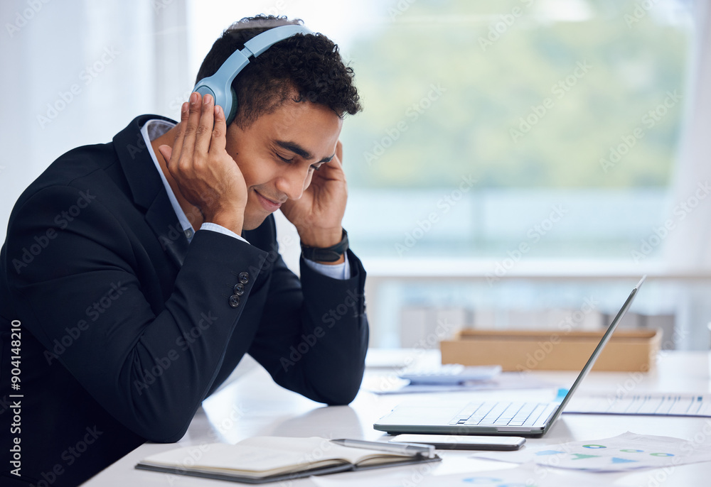 Business, headphones and man at desk, laptop and listening to audio, podcast and connection. Person, employee and consultant with headset, pc and song with break, sound and stress relief in office Business, headphones and man at desk, laptop and listening to audio, podcast and connection. Person, employee and consultant with headset, pc and song with break, sound and stress relief in office