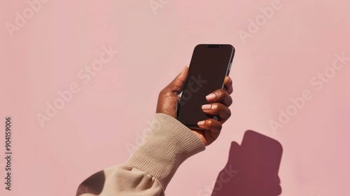 Hand holding phone slight angle gen z klarna neutral background photo