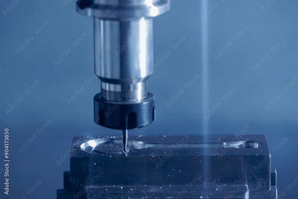 Closeup CNC milling machine during operation. Produced cutting metal parts, banner background of industry heavy factory Closeup CNC milling machine during operation. Produced cutting metal parts, banner background of industry heavy factory