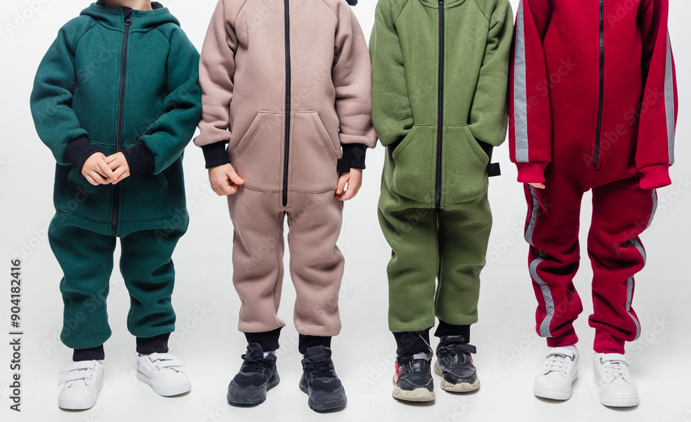 Four children in colorful jumpsuits Four children in colorful jumpsuits
