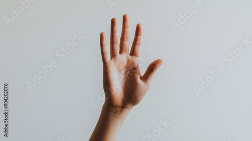 A close-up of an outstretched hand against a light background, displaying the palm and fingers clearly, symbolizing communication or greeting