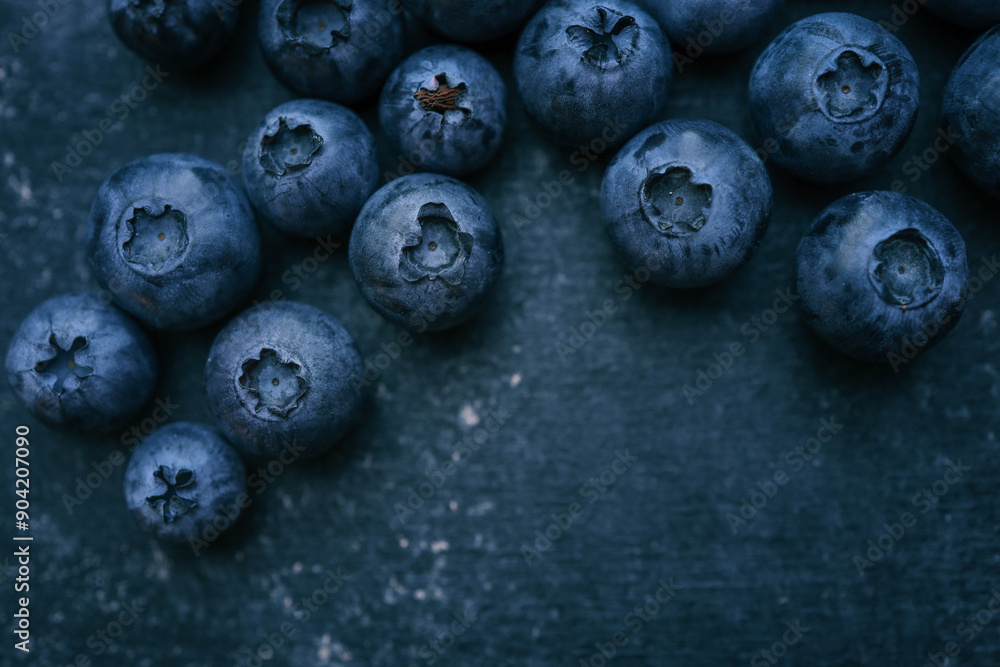 Blueberries background. Blueberry border design. Ripe and juicy fresh picked bilberries close up. Copyspace for your text Blueberries background. Blueberry border design. Ripe and juicy fresh picked bilberries close up. Copyspace for your text