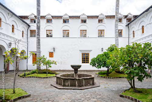 Quito, Pichincha, Ecuador - November 20, 2013: Interior patios and gardens of the San Francisco church and convent, on a sunny and overcast day.