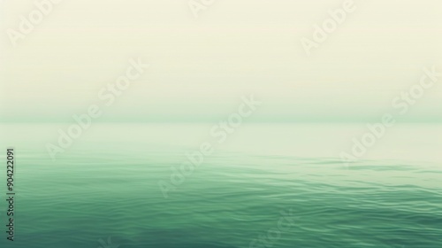 Calm sea water under misty sky.