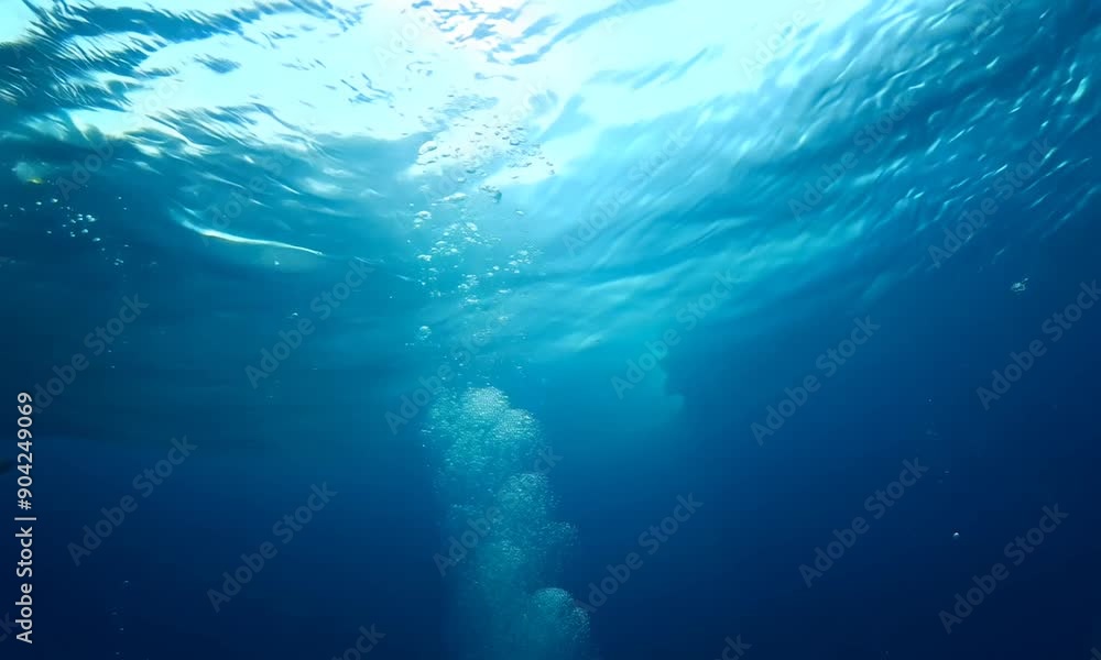 Underwater Bubbles Ascending Through Blue Ocean Depths Underwater Bubbles Ascending Through Blue Ocean Depths