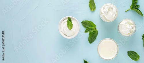 Wallpaper Mural Top view of various dairy products and fresh mint against a light blue backdrop with room for text in copy space image Torontodigital.ca