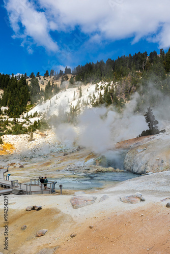 dramatic volcanic landscape of hot steams and sulfur laden pools, hydrothermal area  in Bumpass Hell in Lassen National Park. photo