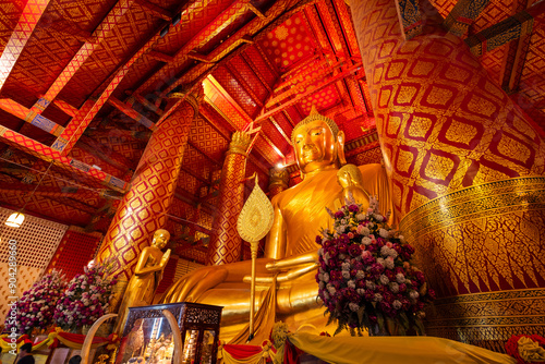 AYUTTHAYA, THAILAND - June 4, 2024 : Buddha statue at Wat Phanan Choeng temple at Wat Phananchoeng, Ayutthaya, Thailand. photo