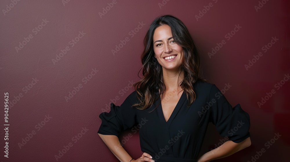 Depict a smiling woman with her hand on her hip, posed against a rich burgundy wall, enhancing the depth and warmth of the portrait Depict a smiling woman with her hand on her hip, posed against a rich burgundy wall, enhancing the depth and warmth of the portrait