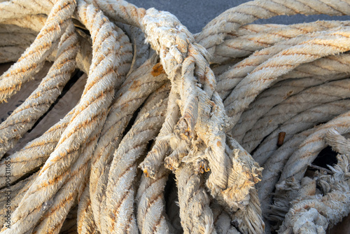 Close-up of worn industrial ropes photo