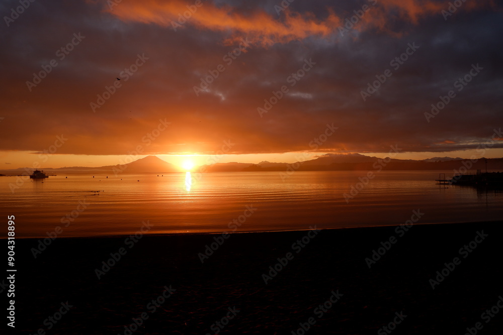 Dramatic sunrise over Lake Llanquihue in the Chilean Lake District in the winter Dramatic sunrise over Lake Llanquihue in the Chilean Lake District in the winter