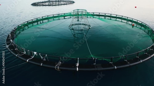 Norway marine fish farms with round enclosures closeup. Farm infrastructure with circular net cages promote sustainable and productive aquaculture