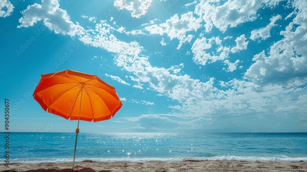 Vibrant beach umbrella under a clear blue sky at seaside paradise Vibrant beach umbrella under a clear blue sky at seaside paradise