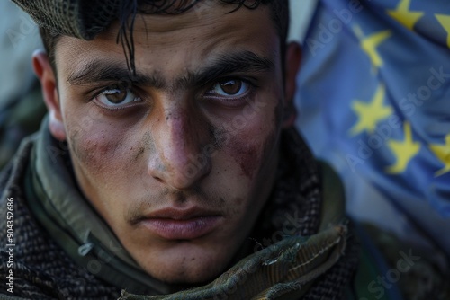 Young man faces hardship eu flag background tells his story. EU residents call for tighter border controls.  Portrayal of afghan man challenges viewers' empathy and awareness. photo