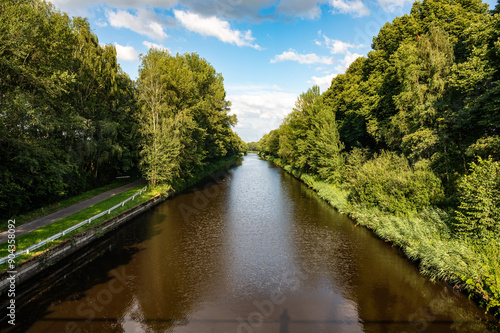 Perspective view over the Zuid Willmesvaart canal with tree reflections around Lieshout, North Brabant, The Netherlands photo