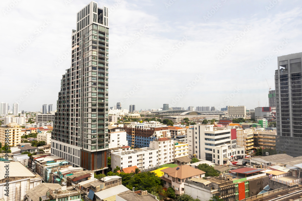 Fototapeta premium Tall structures in a large metropolis Large metropolis by day, panoramic picture of the city