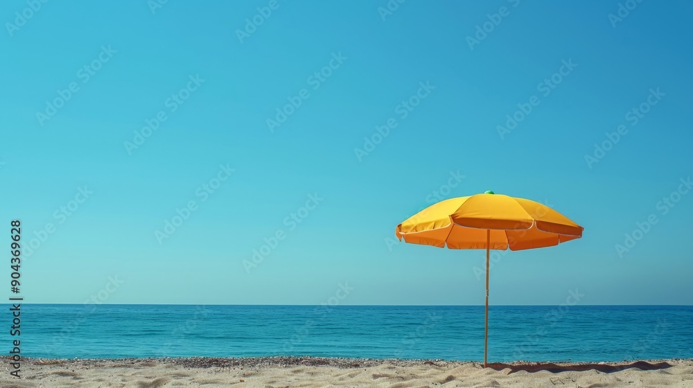 Colorful beach umbrella under clear blue sky at seaside resort Colorful beach umbrella under clear blue sky at seaside resort