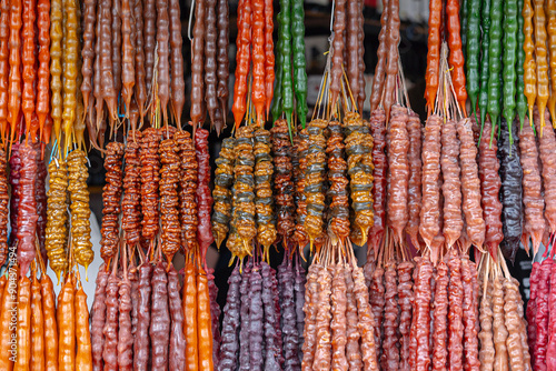 Churchkhela is a national Georgian sweet - nuts in dried grape juice. photo