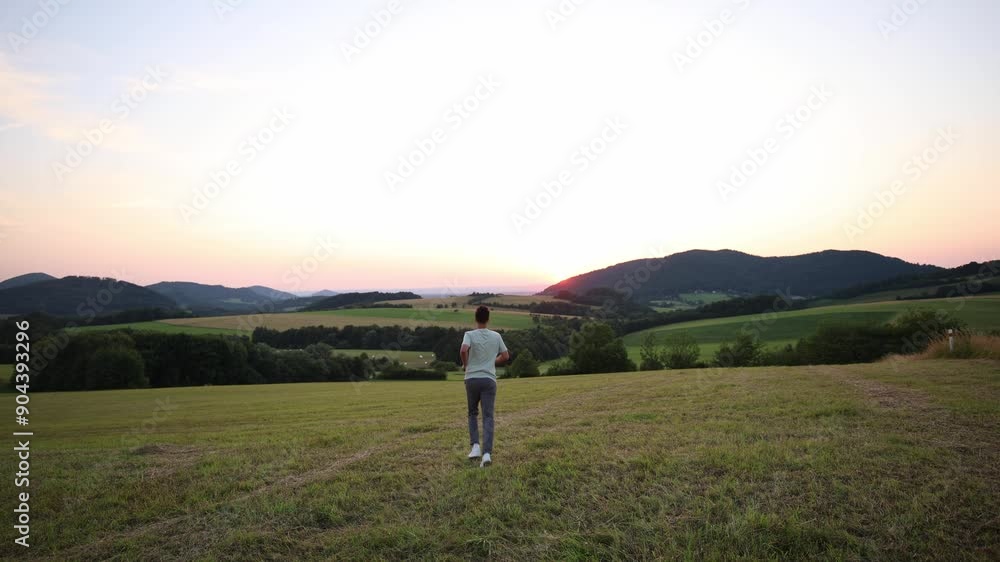 Slow motion video of a brown haired man running at sunset. The joy of being free. 4k video Slow motion video of a brown haired man running at sunset. The joy of being free. 4k video