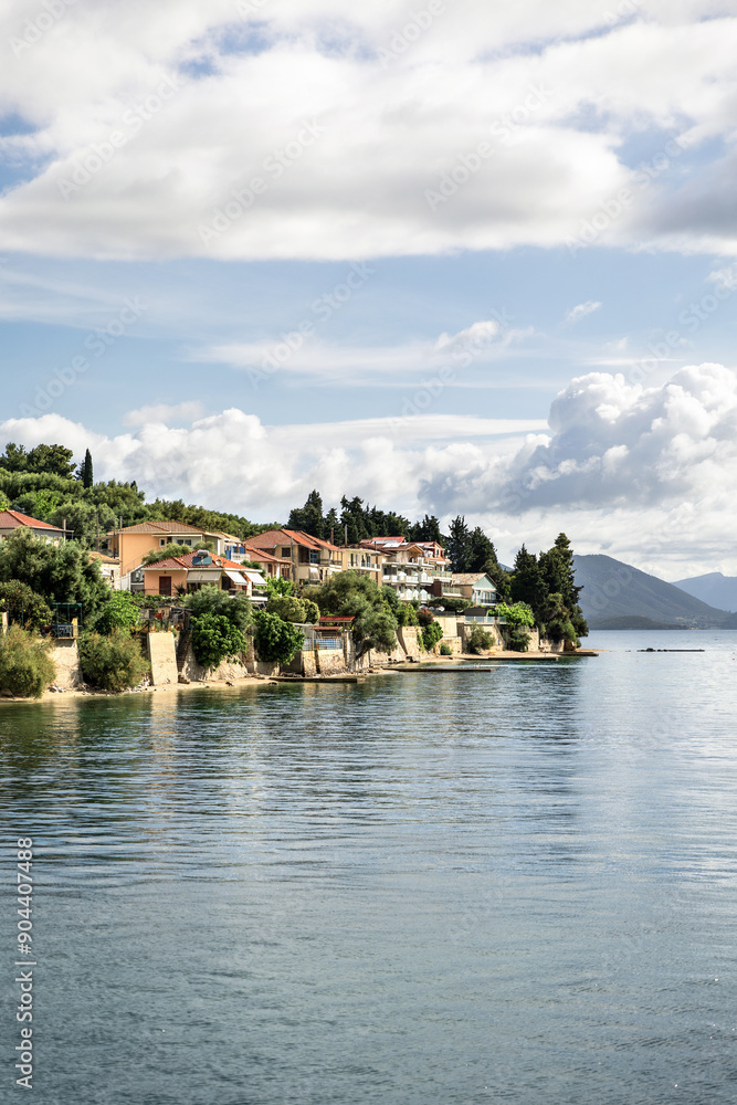 Fototapeta premium Cruise from Nidri port in Lefkada or Lefkas Greek island, Ionian Sea near Preveza. Summer vacation on boat, cloudy sky