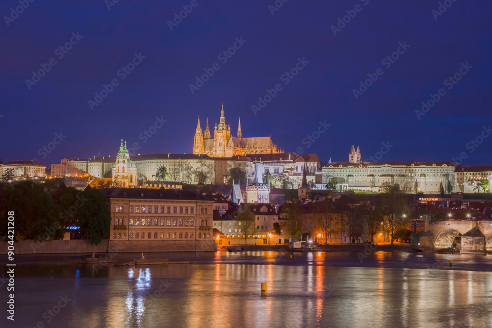 Vltava river with famous Hradcany castle and St. Vitus Cathedral in Prague, Czech Republic, by night Vltava river with famous Hradcany castle and St. Vitus Cathedral in Prague, Czech Republic, by night